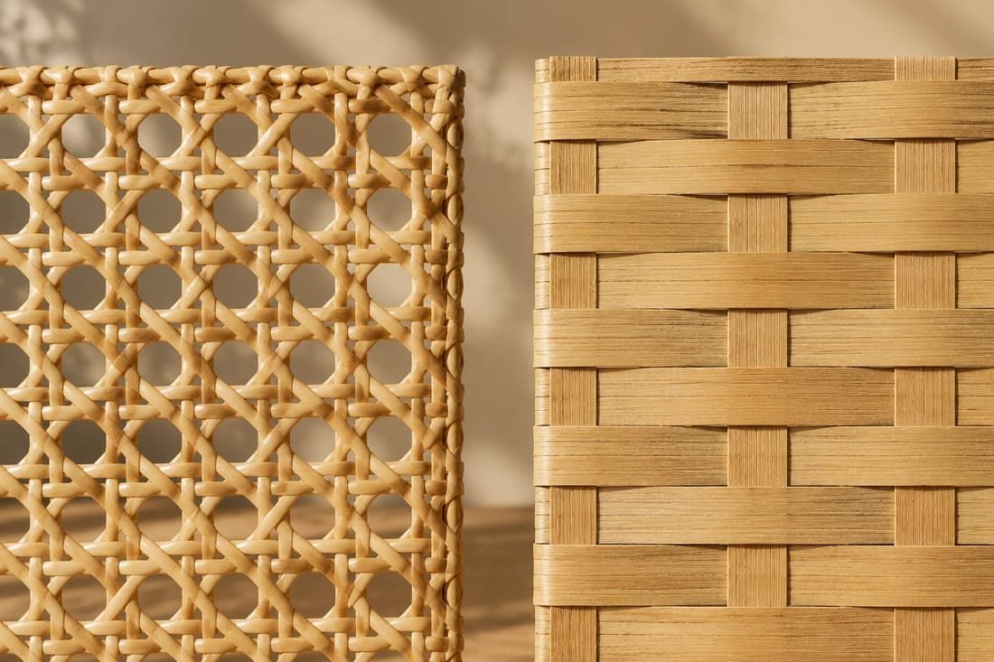 Macro view of hand-woven rattan structure showing the open hexagonal cane pattern